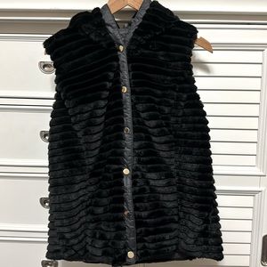 Women’s reversible coat vest with hoodie.